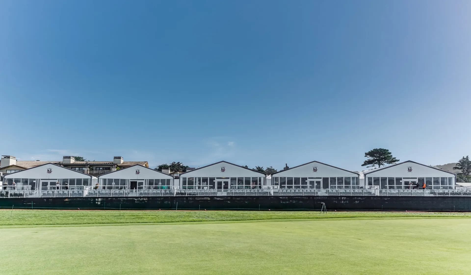 Line of US Open a-frame tents across the horizon