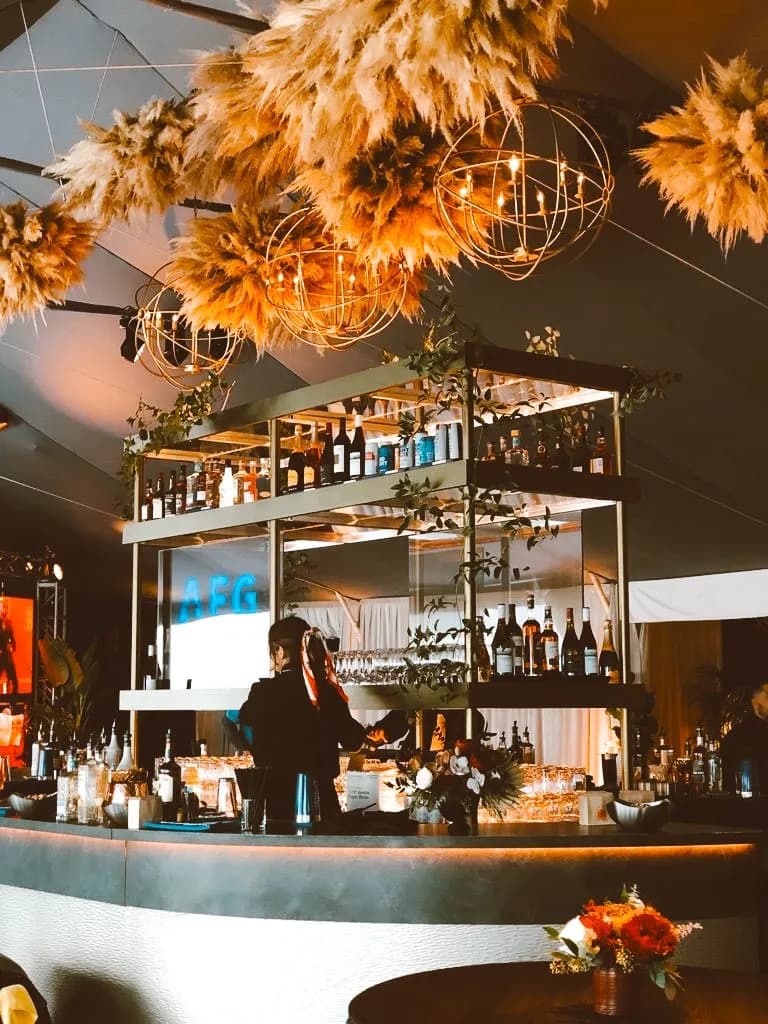 Custom AEG bar with suspended glass shelving