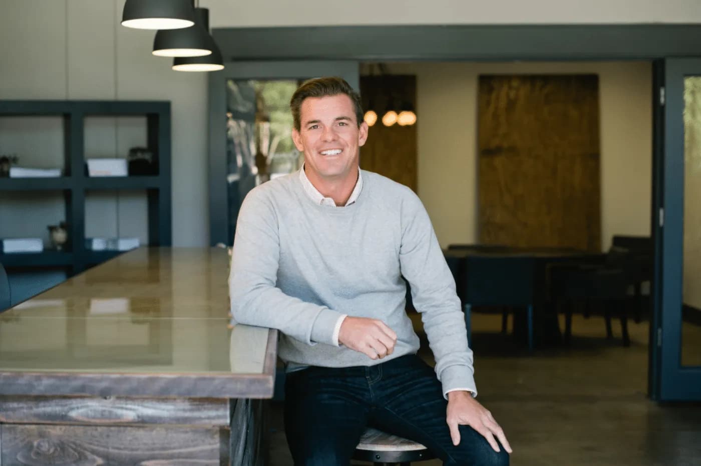 Ryan Choura sitting at bar in Choura Office