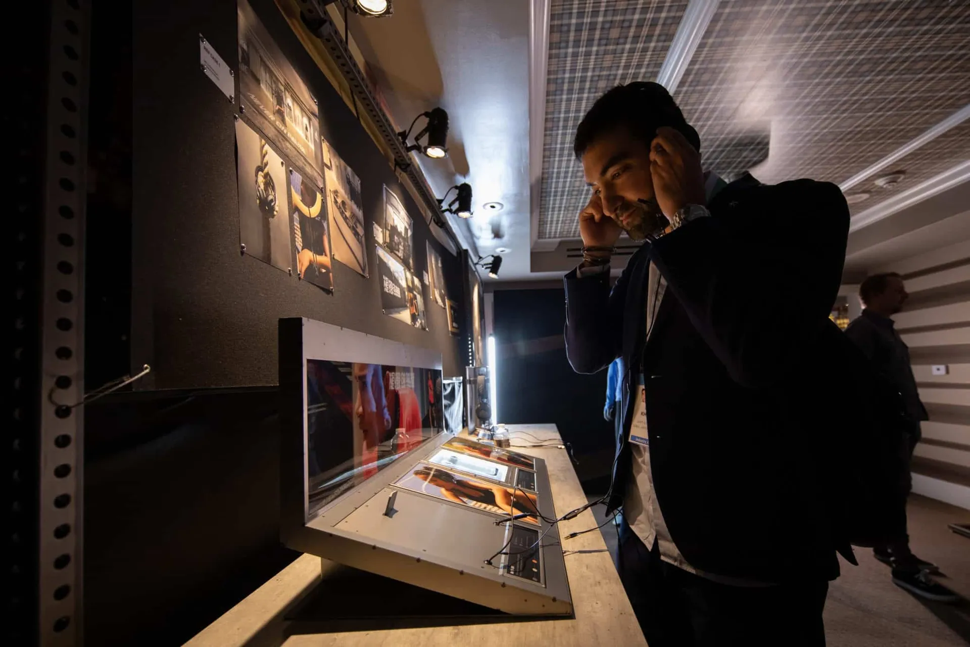 An attendee listening at the Zound Industries CES booth