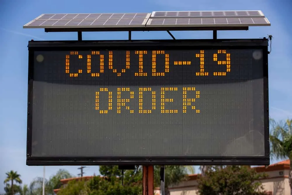 Digital Highway sign with "COVID-19 ORDER" spelt out
