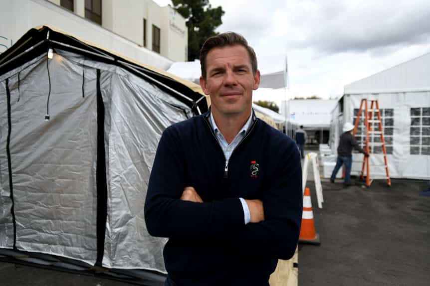 Ryan Choura in front of four tent installations at Lakewood Regional Medical Center 