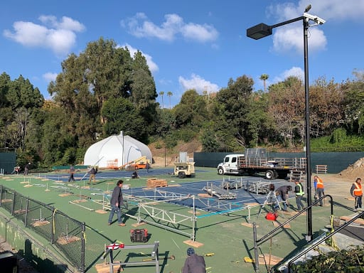 Choura Events team setting up temporary structure foundation