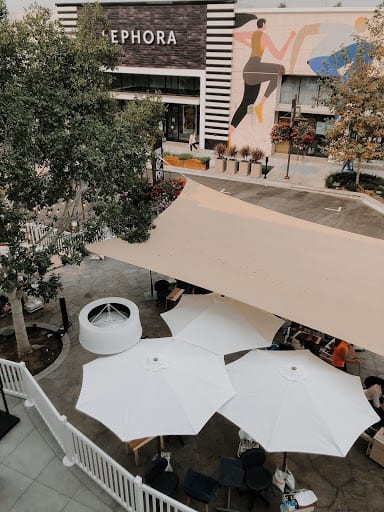 Outdoor deck with weatherproof umbrellas