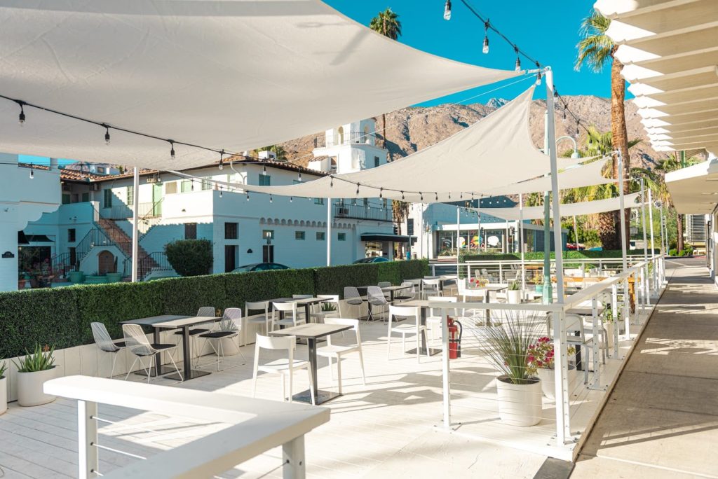 Large white monochrome outdoor extended dining deck