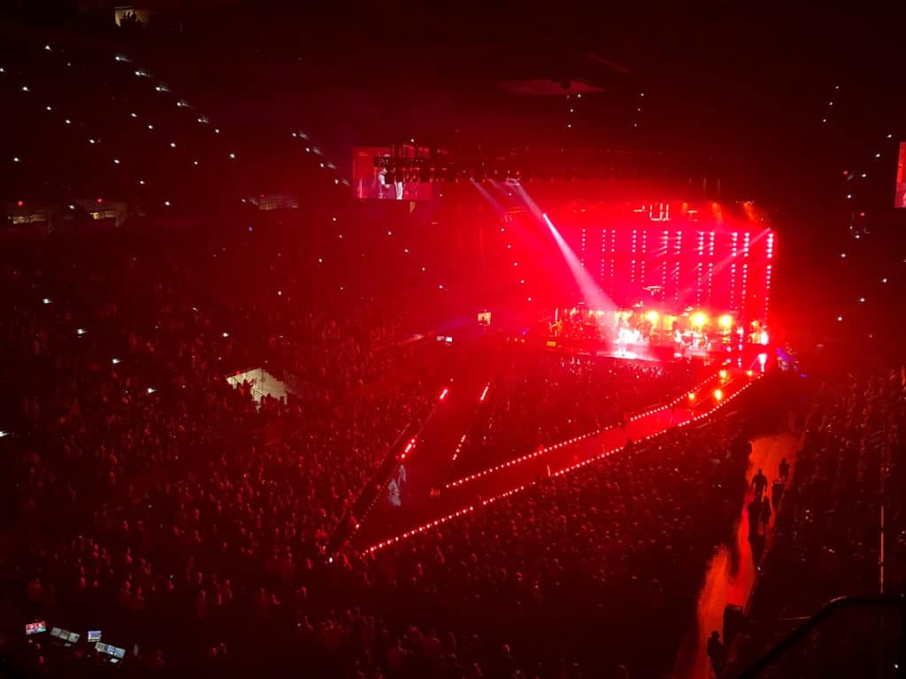 Large concert venue showcasing a Thrust Stage in Red lights